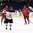 SPISSKA NOVA VES, SLOVAKIA - APRIL 21: Latvia's Viktors Jasunovs #22 celebrates with Regnars Udris #6 and la12/ after a third period goal by Verners Egle #9 (not shown) while Artyom Baltrik #9 and Dmitri Deryabin #4 of Belarus looks on during relegation round action at the 2017 IIHF Ice Hockey U18 World Championship. (Photo by Andrea Cardin/HHOF-IIHF Images)

